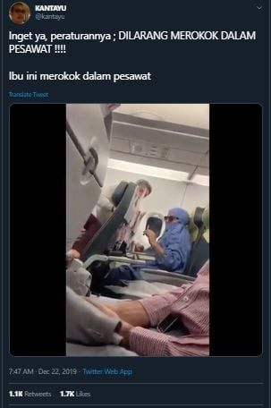 Wanita merokok di dalam kabin pesawat. (Twitter/@kantayu)