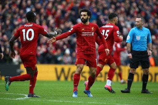 Pemain Liverpool Mohamed Salah rayakan golnya ke gawang AFC Bournemouth di Anfield, Sabtu (7/3/2020). [AFP]