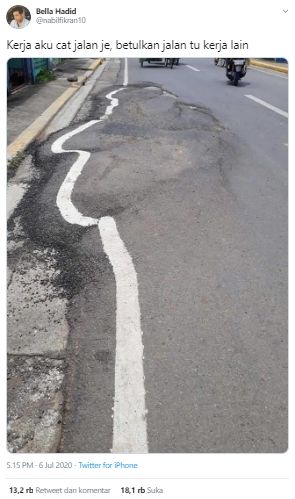 Jalan rusak berliku tetap dicat (Twitter).