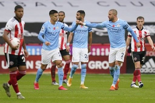 Pemain Manchester City Kyle Walker rayakan golnya ke gawang Sheffield United dalam pertandingan pekan ketujuh Liga Premier Inggris yang berlangsung di Bramall Lane, Sabtu (31/10/2020). [AFP]