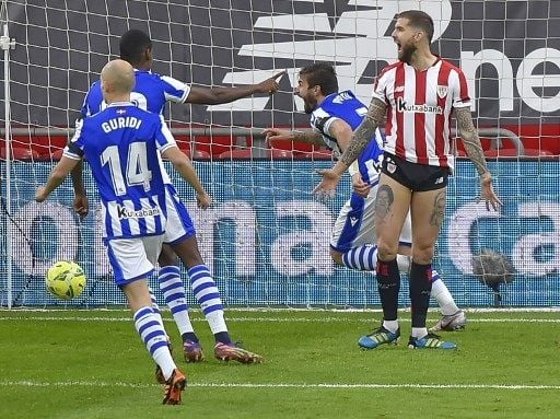 Pemain Real Sociedad Cristian Portu rayakan golnya ke gawang Athletic Bilbao di San Mames dalam pertandingan Liga Spanyol, Kamis (31/12/2020). [AFP]