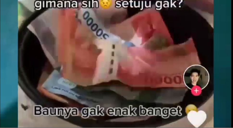 Viral uang dipanaskan di rice cooker untuk bunuh virus Corona. (Dok. Youtube)