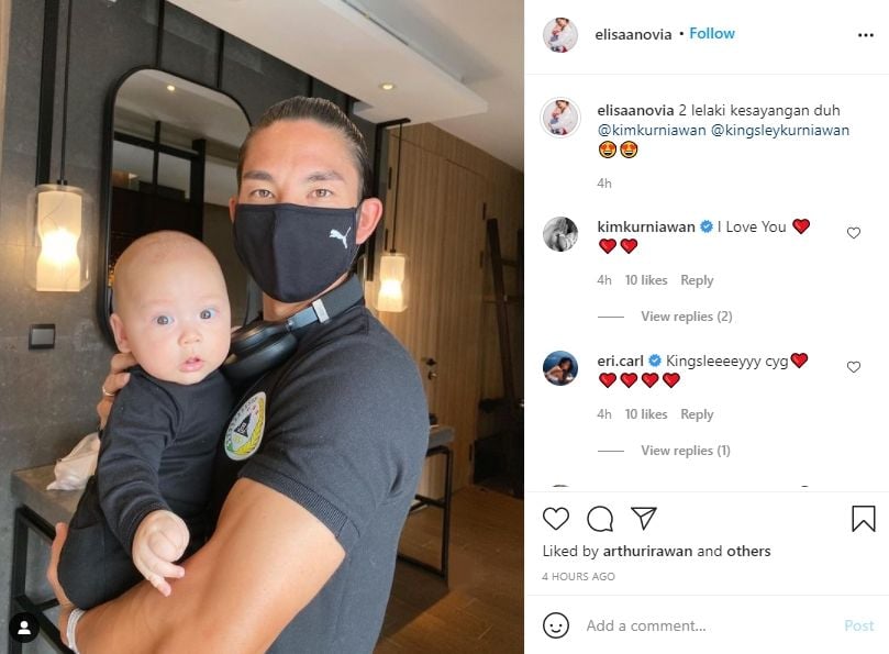 Elisabeth Novia bagikan potret Kim Kurniawan gendong anaknya. (Instagram/elisaanovia)