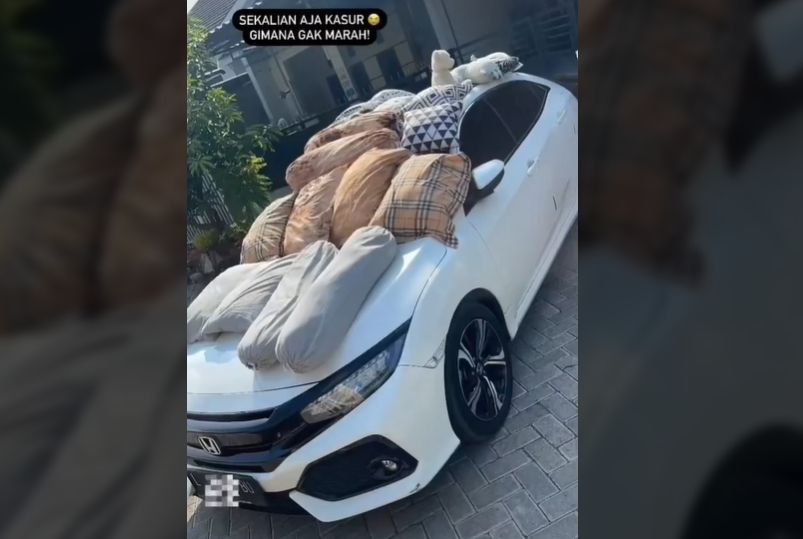 Pria Syok Atap Mobil Penuh Jemuran Bantal Tetangga, Auto Dibawa Kabur Biar Kapok (TikTok).