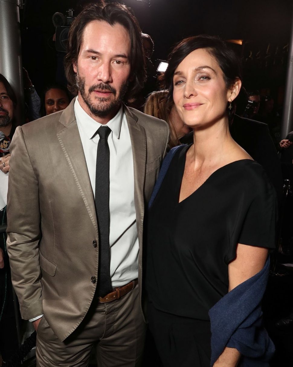 Keanu Reeves dan Carrie-Anne Moss [Instagram @carrieanne.moss]