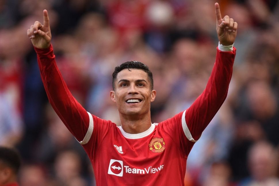 Ekspresi megabintang Manchester United, Cristiano Ronaldo usai mencetak gol dalam laga Liga Inggris kontra Newcastle United di Old Trafford, Manchester, Sabtu (11/9/2021) malam WIB. [OLI SCARFF / AFP]