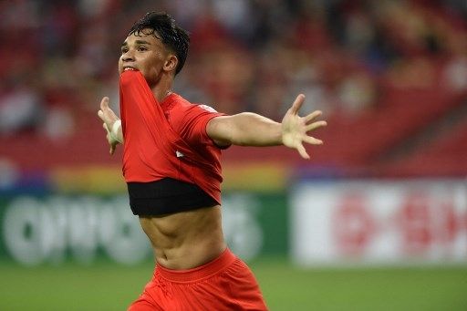 Pemain Singapura Ikhsan Fandi rayakan gol ke gawang Indonesia dalam pertandingan leg pertama semifinal Piala AFF 2020 di Stadion Nasional, Rabu (22/12/2021). [AFP]