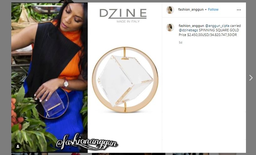 Anggun C Sasmi mengenakan tas unik berbentuk kubus (Instagram/@fashion_anggun)