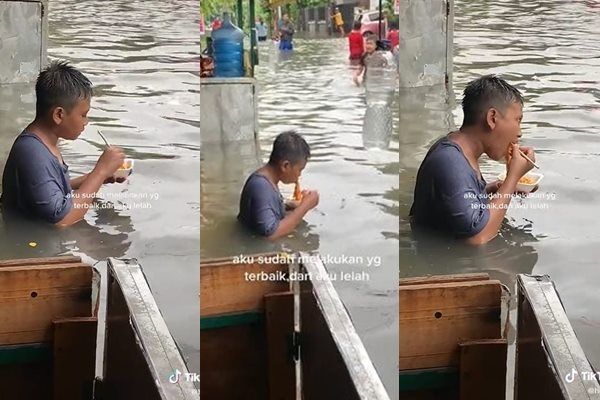 Viral Bocah Asyik Nyruput Mie Meski Tubuh Terendam Banjir. (TikTok)