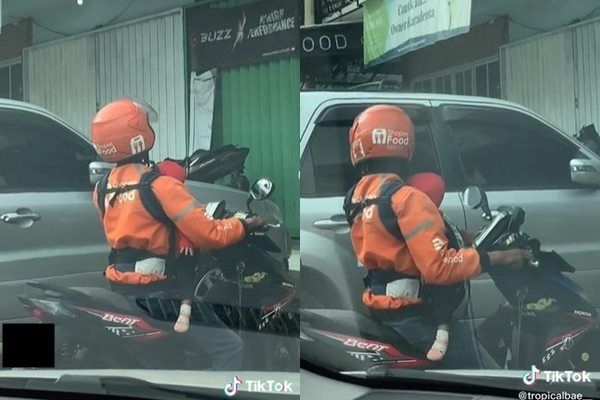Viral Driver Ojol Kerja Sambil Gendong Anak. (TikTok)