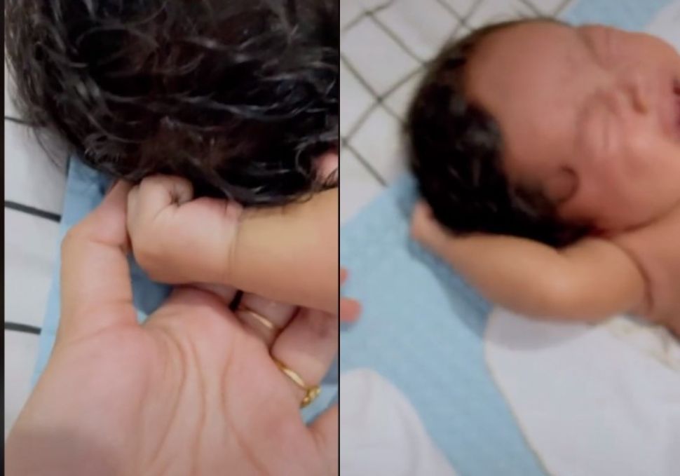 Bayi nangis karena tangannya sendiri (tiktok.com/@andrianiiksp)