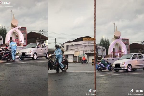 Viral Pria Tarik Mobil Mogok Pakai Motor. (TikTok)