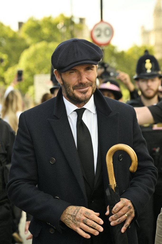 Mantan pesepak bola Inggris David Beckham meninggalkan Westminster Hall, di Istana Westminster, di London pada 16 September 2022 setelah memberikan penghormatan kepada mendiang Ratu Elizabeth II. Ratu Elizabeth II akan disemayamkan di Westminster Hall di dalam Istana Westminster, hingga pukul 05:30 GMT pada 19 September, beberapa jam sebelum pemakamannya, dengan antrean besar diperkirakan akan melewati peti matinya untuk memberi penghormatan.Louisa Gouliamaki / AFP.