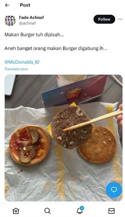 Makan burger pakai nasi. (Dok. Tangkapan Layar)