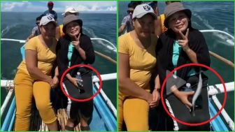 VIRAL! Emak-Emak Bingung HP Lenyap Dibawa Ikan saat Ayik Berfoto, Komentar Netizen Bikin Ngakak: Tinggal Diciduk Pelakunya...