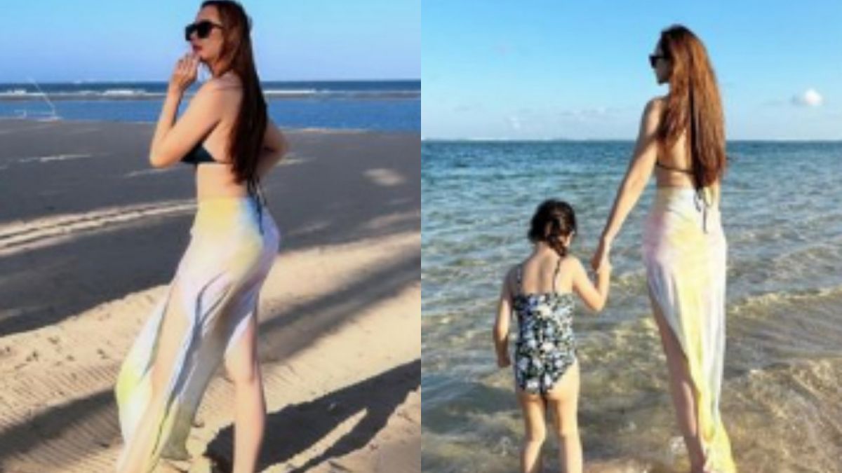 Momen Aura Kasih liburan ke pantai bersama anak semata wayangnya [Instagram @aurakasih]