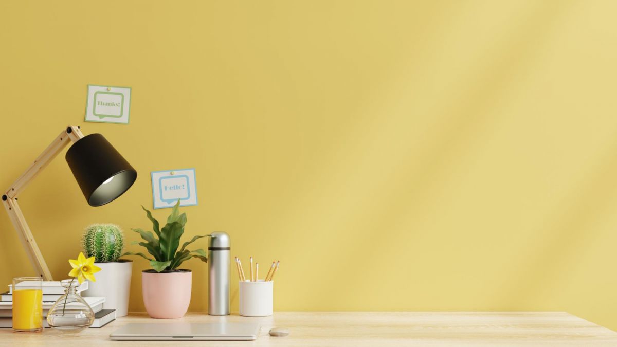 working-room-with-laptop-working-equipment-yellow-wall-3d-rendering
