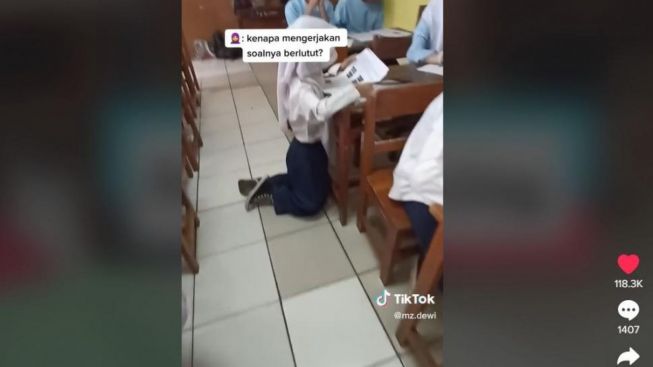 Siswi Ini Terpaksa Berlutut saat Kerjakan Soal Ujian, Penyebabnya Malah Bikin Publik Geli