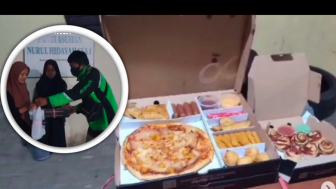 Dapat Orderan Fiktif Pizza 459 ribu, Driver Ojol Pilih Sumbangkan ke Panti Asuhan, Warganet: "Calon Penghuni Surga"