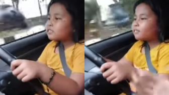 VIRAL! Bocah Dilatih Nyetir Mobil: Polisi Temanku