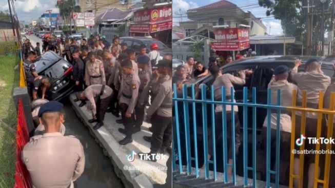 Viral Puluhan Personel Brimob Bantu Evakuasi Mobil yang Masuk Parit